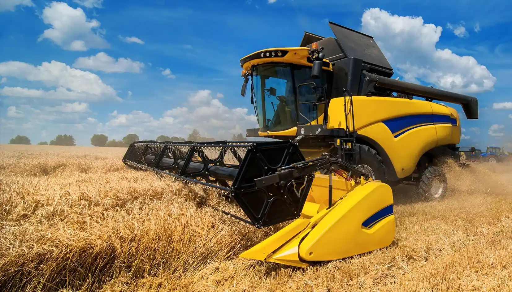 Agricultural heavy equipment operating in a field